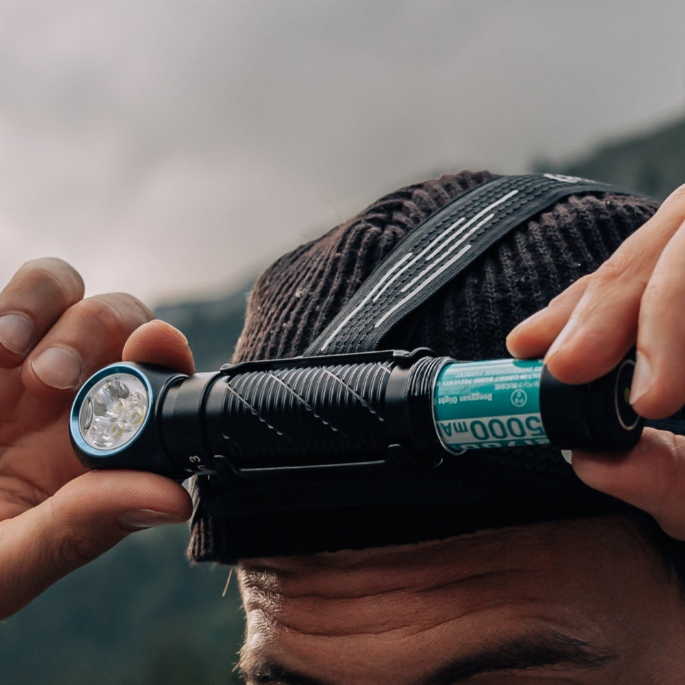 Orange Olight Perun 3 Versatile Led Rechargeable Head Torch from Head to Hand