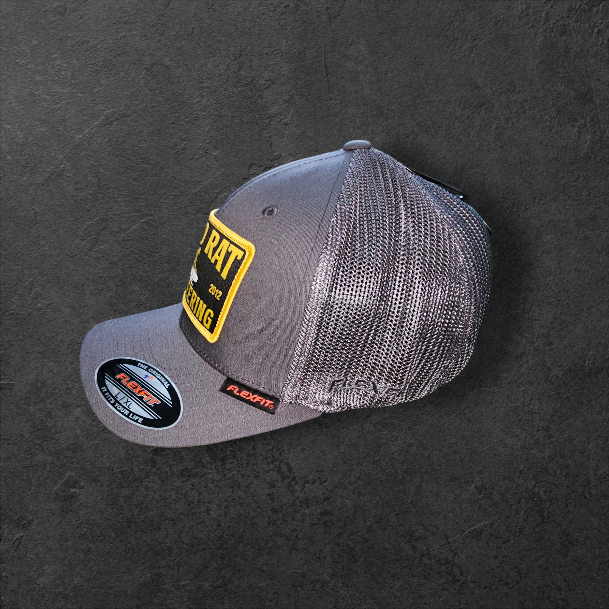 FLEXFIT® Mesh Trucker Cap | CHARCOAL Gold rat Engineering